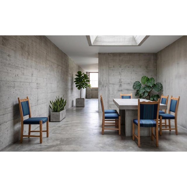 Set of six dining chairs in solid oak attributed to Danish designer Henning Kjærnulf, produced in Denmark during the...
