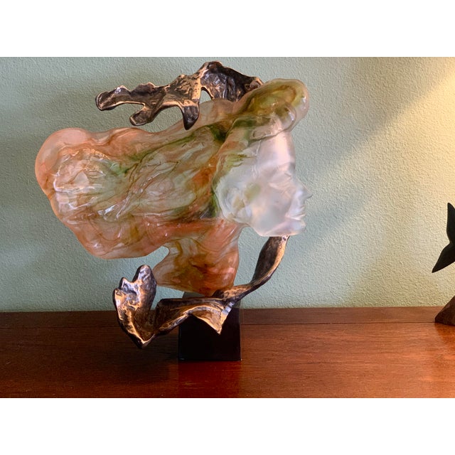 A luminous sculptural study in bronze and pâte de verre by French artist Yves Lohé (b. 1947), titled Le Vent (The Wind)....