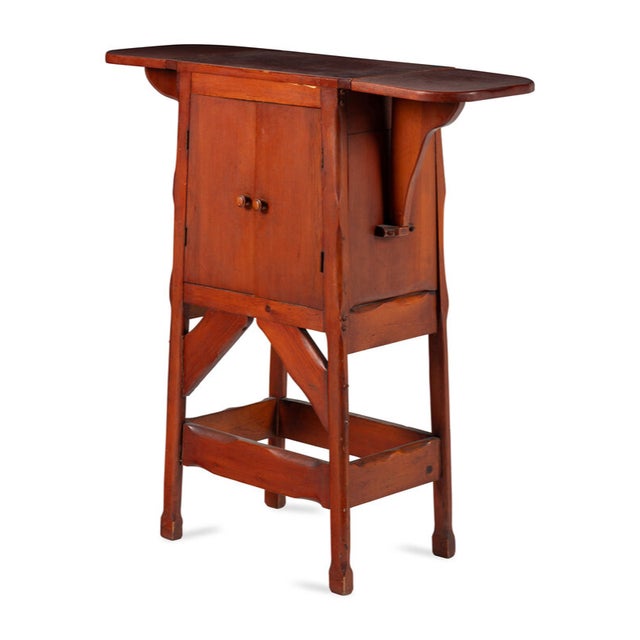 Unusual raised cabinet with fold-up extensions. It would make a great bar. Two doors open to a nice space. Simple fold-...