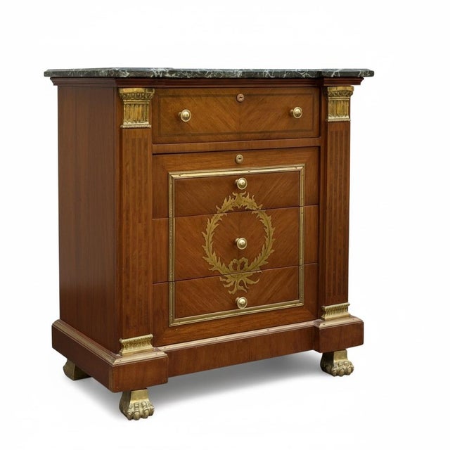 This is a late 20th century neoclassical style mahogany veneered chests with green marble tops. The commodes have Doric...