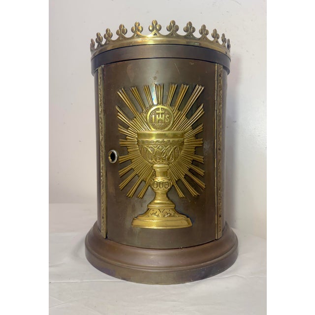 Up for sale is a large antique bronze religious Catholic church altar tabernacle. This cylindrical box is lined in an...