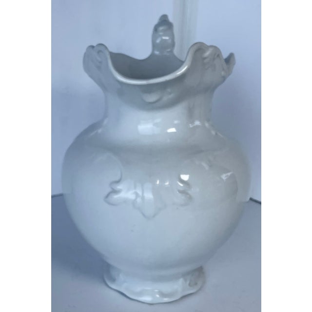A beautiful piece with raised scrollwork in plain white, this decorative large ironstone pitcher can be used as a vase for...