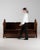 Here is a dining chair, its dark leather, brass nailhead trim, tufted button the first thing to catch the eye. Dating to...