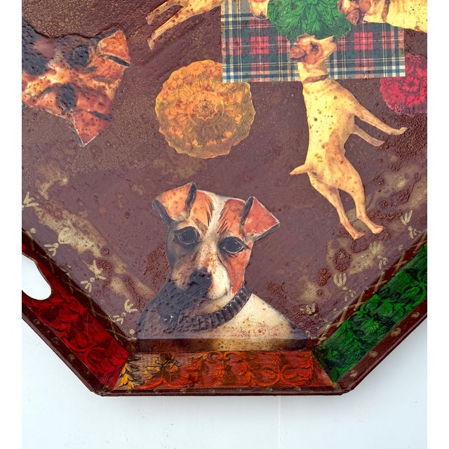 A large octagonal metal tray featuring an elaborate decoupage of Jack Russell terriers, tartan plaid and floral motifs. At...