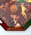 A large octagonal metal tray featuring an elaborate decoupage of Jack Russell terriers, tartan plaid and floral motifs. At...