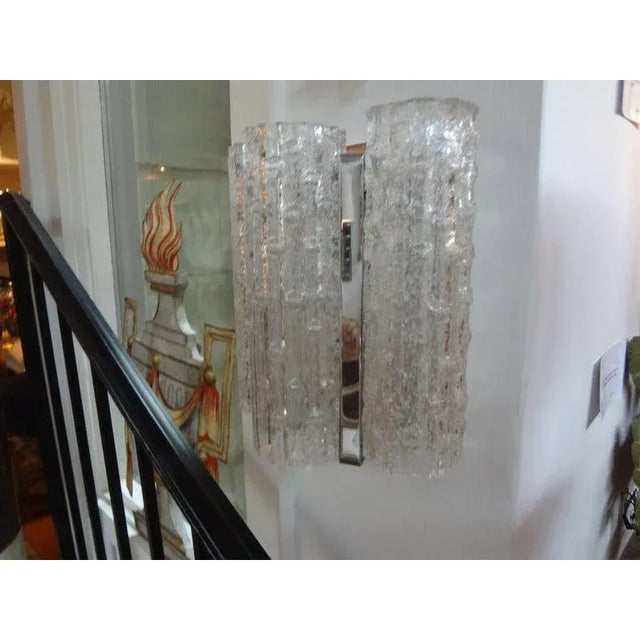 Pair of Italian Mid-Century Modern Venini style Murano glass sconces with chrome bases. These Murano sconces or Venetian...
