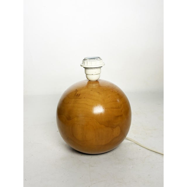 The lampshade is not included. A us adapter is provided. A spherical wooden lamp, made in france in the 1980s, with a...