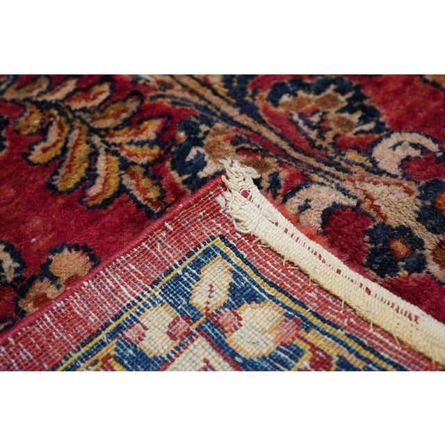 This 30's west Persian well-woven village carpet, shows the characteristic "American Sarouk" pattern of floating, detached...