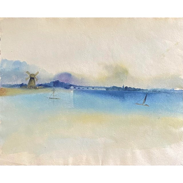 Original Watercolor on handmade artist’s paper of a tranquil landscape with a windmill in the background and sailboats in...