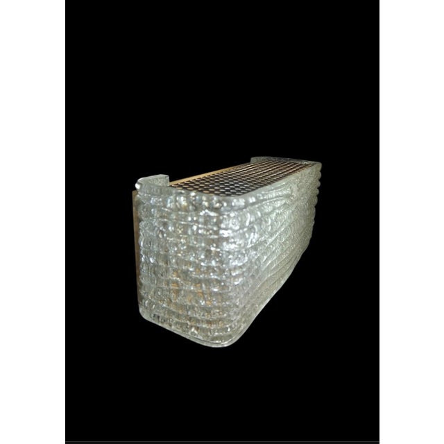 This exclusive pair of wall lamps, produced by the prestigious German manufacturer Kaiser Leuchten in the 1970s, perfectly...