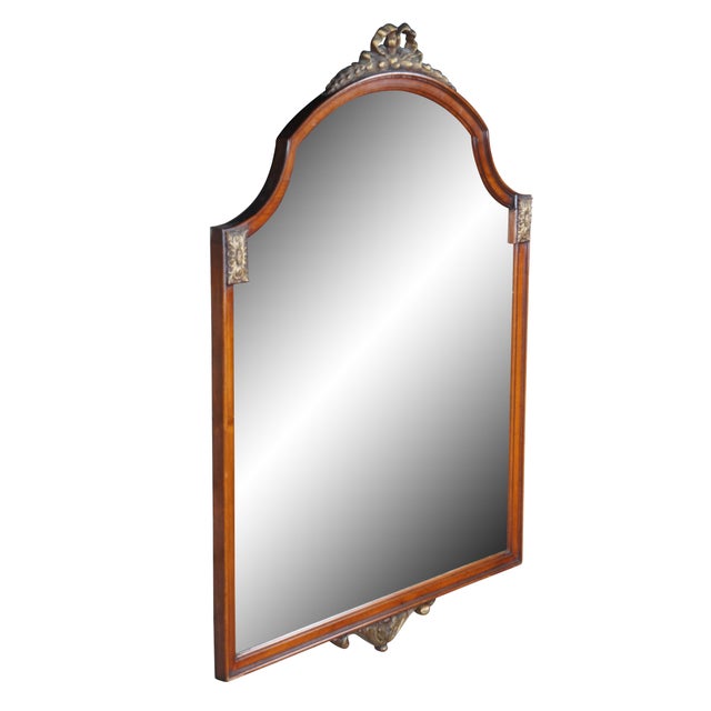 20th Century French Louis XV Style Mahogany wall mirror. Features a rectangular shaped framed with contoured and arched...