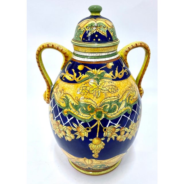 Vintage hand-painted ceramic Daruta style Italian lemon and acanthus leaf lidded canister with handles. Depicts garlands...