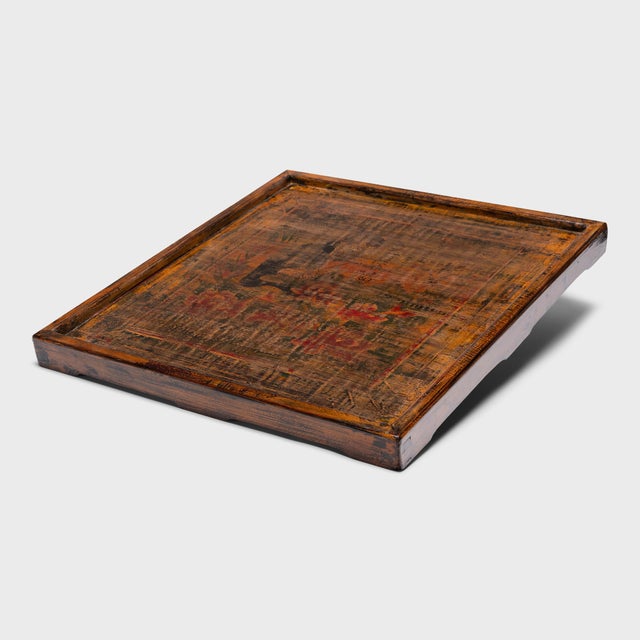 This large wooden serving tray is crafted with a hand-painted panel salvaged from a vintage Chinese cabinet. Selected for...