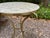 Italian Brass And Capiz Shell Table. Offered is a stunning vintage Italian brass tripod table with a Capiz shell top. This...