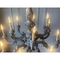 This impressive French 20th-century chandelier is a finely carved work in wood, distinguished by its grand scale and...