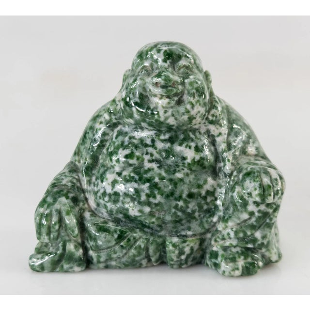 We are selling this cool Chinese carved figure of Laughing Buddha or Hotei carved from an interesting green and white...