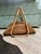 Striking vintage Italian pencil reed rattan magazine rack featuring a sculptural fan-shaped silhouette formed from...