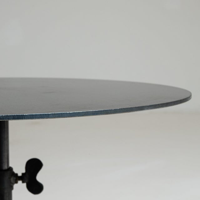 Round stone-base side table in Deep Charcoal Grey. Its deep charcoal grey finish sets off rounded natural stone base, slim...