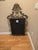 Substantial, vintage, antique bronze wrought iron mirror with elaborate scrollwork detail, beveled edge, and elaborate...
