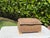 Striking vintage decorative box featuring elaborate hand-carved tropical foliage and animal motifs throughout, accented...