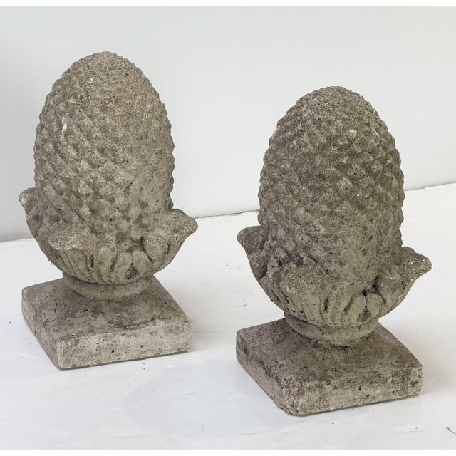 A pair of fine English garden ornamental statuary finials or copings of composition stone - each lightly weathered and in...
