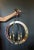 Chic Mid Century Modern Italian style mirrored circular pendant chandelier. Featuring two iron and antiqued faceted...
