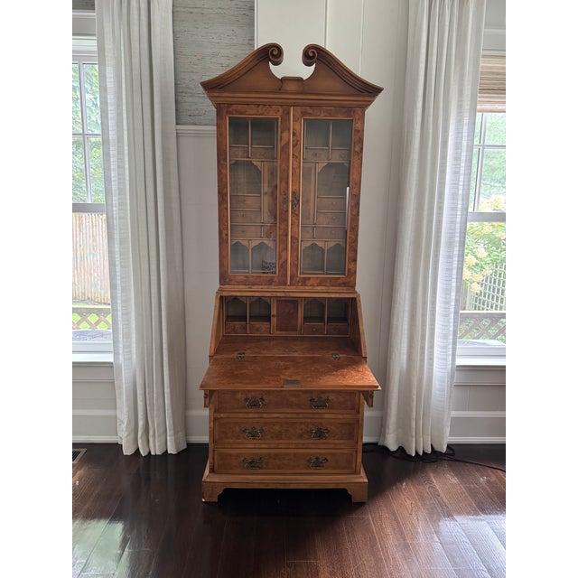 Beautiful Trouvailles Inc of Watertown, MA burlwood secretary. The upper cabinet has divided glass doors, opening to an...
