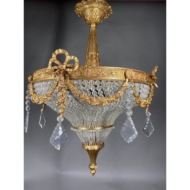 Add timeless French elegance to your interior with this refined Louis XVI-style chandelier, crafted in France during the...