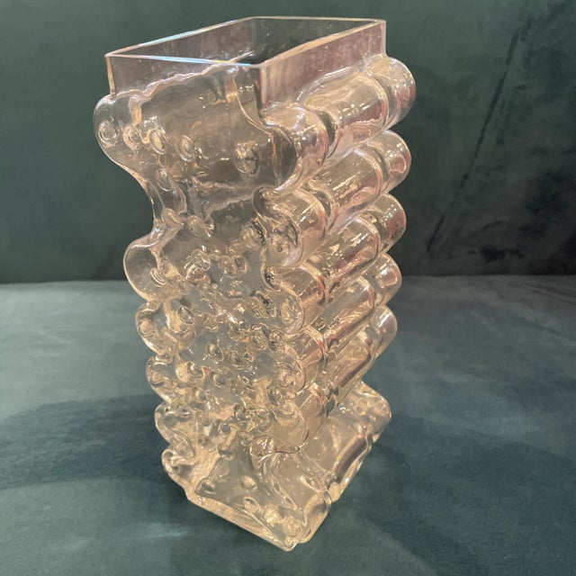 Curvaceous textured transparent glass vase. It has hobnail sides and channeled sides creating this fantastic shape and...
