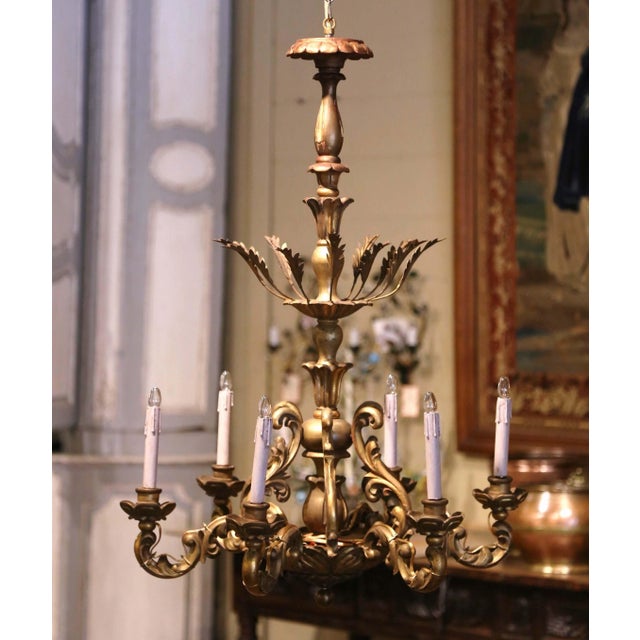 Decorate a dining room, breakfast room or entry with this antique gilt wood chandelier. Hand carved in France circa 1920,...