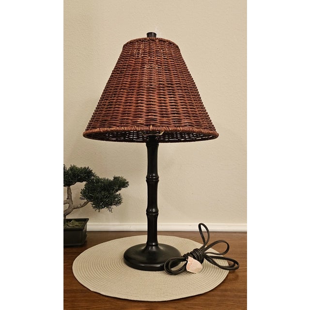 Add warm, natural charm to your space with this vintage rattan table lamp. Featuring a woven rattan body with beautiful...