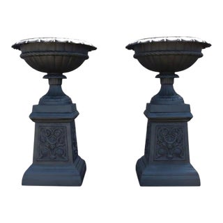 Pair of Antique Cast Iron Garden Urns With Stylized Floral Bases C1900 For Sale