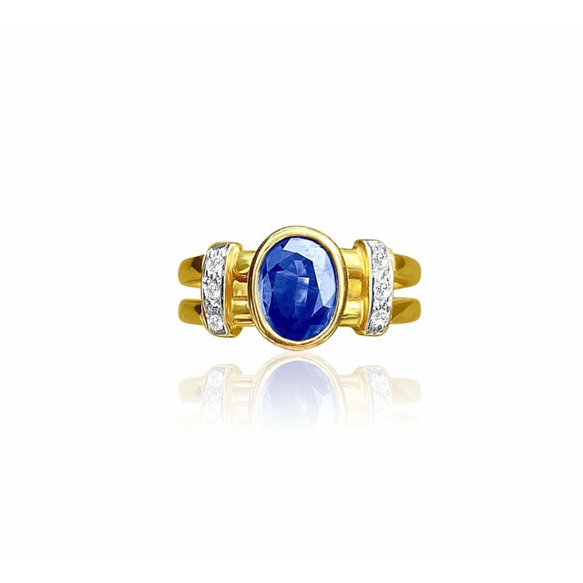 Dark blue natural Sapphire center stone is set with 0.12 carats in natural diamonds. Stones are all set in a gorgeous 14k...