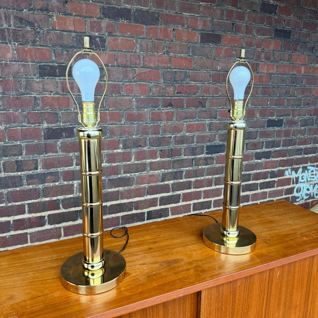 Pair of vintage brass table lamps dimensions listed are with shades the lamps have a 7.5 inch diameter round base and...