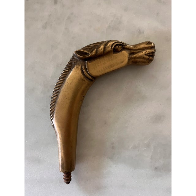 Vintage solid brass horse head that most likely came from a cane or walking stick. Would make an interesting hook if...