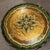 A round Florentine gilt tray, made in Italy. Crafted in wood with a softly antiqued gold finish, this piece features...