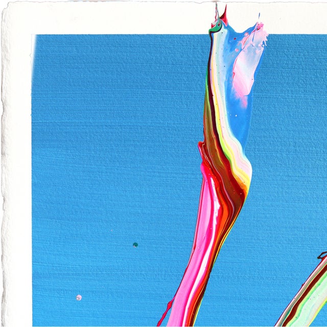 The colorful abstract artworks of Romanian artist Alex Voinea are inspired by experiments with paint poured over vibrating...