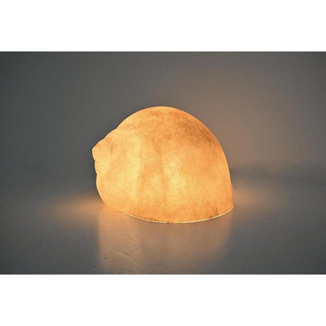 Snail-shaped lamp made of fiberglass and marble powder. Wear and tear due to time and the age of the lamp. This piece is...