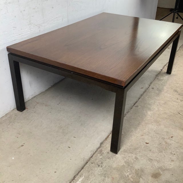 Sophisticated in its simplicity, this vintage Mid-Century Modern coffee table embodies the clean architectural aesthetic...