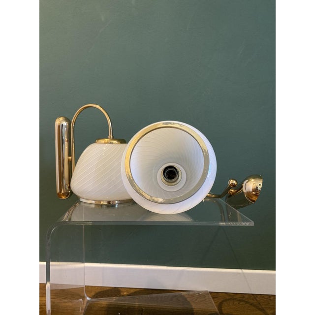 Pair of two vintage white Murano glass spiral wall sconces with gold-plated brass. Handcrafted in Murano, Venice, Italy,...