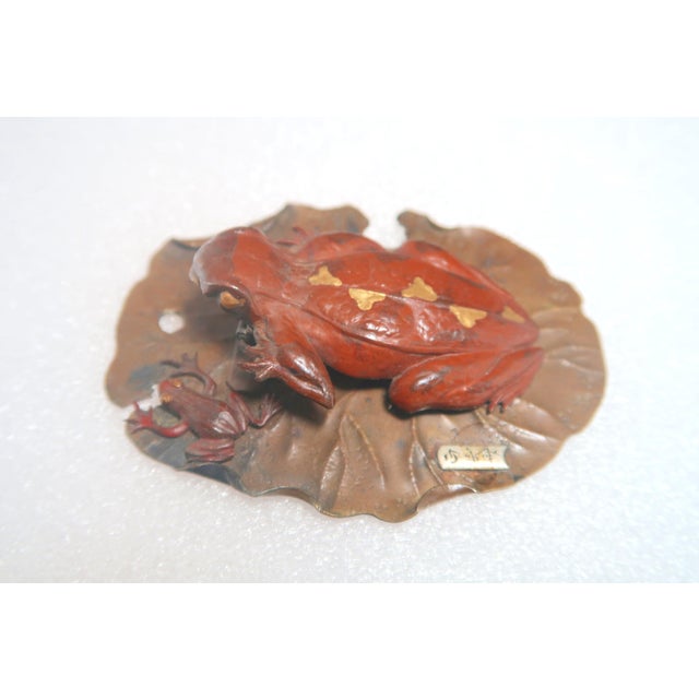 I am proud to present this precious Japanese gold and silver Inlaid bronze frog group from the Meiji Period. Two frogs,...