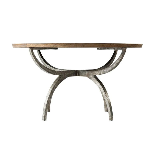 A round dining table with beveled edge and oak parquetry top and a walnut line inlays. Finished in our Echo Oak finish and...