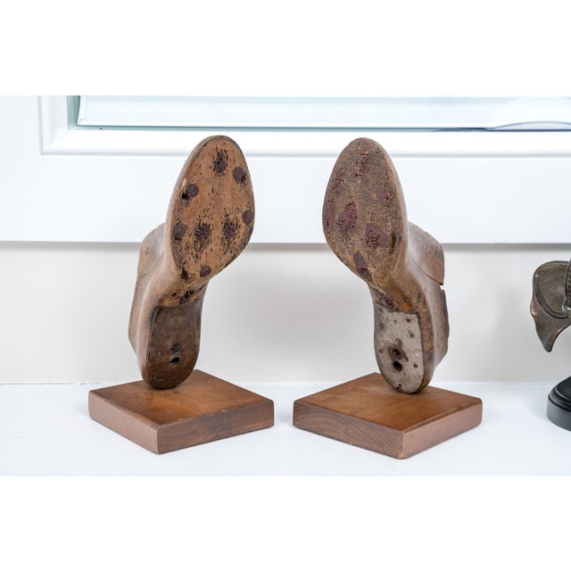 A pair of wooden shoe making molds repurposed as bookends with plinth bases. A wooden shoe mold were traditionally made...