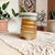 Elevate your home decor with our Artisan Stamped Wheel Thrown Pottery Bud Vase, featuring a unique textured spiral design...
