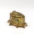 Of octagonal serpentine form, the body and domed lid in green enamel over gilt metal, decorated on all sides with...