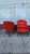 Vintage-style armchairs with red leather upholstery. Each chair has a tufted backrest and seat with decorative nailhead...