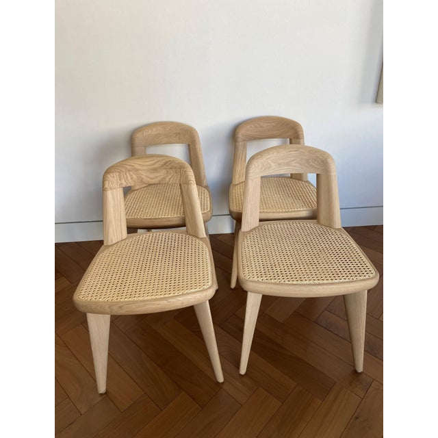 Exceptional set of four armless BassamFellows Brutus chairs in raw oak with double caned seats, hand crafted in Italy....