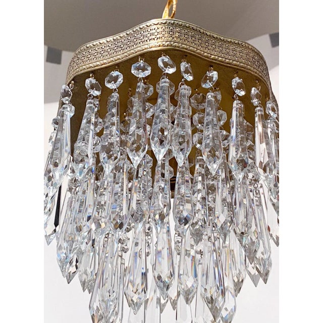 Italian upside down layered rim chandelier with brass rim and 30% leaded crystal plug drops. Restored, rewired and it has...