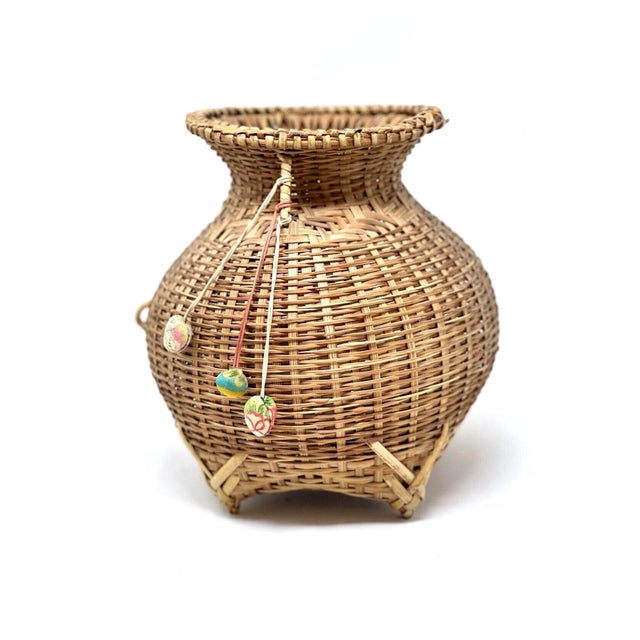 Nice vintage Asian Bamboo basket with silk wrapped shells for good luck. These baskets were traditionally made and used by...