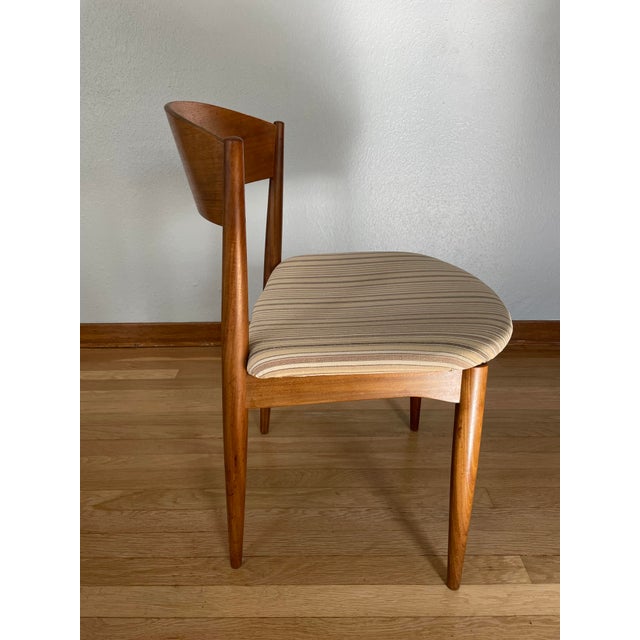An exquisite vintage Danish Mid Century Modern teak dining chair by Jydsk Møbelindustri Skanderborg, circa 1963. This...